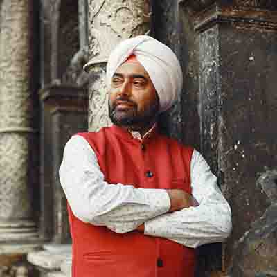 Portrait of man who used our taxi service in chandigarh from chandigarh airport to delhi airport in affordable prices.